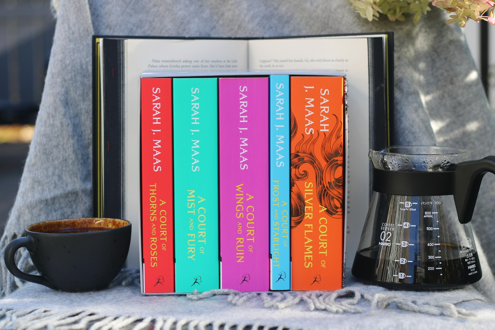 A table topped with books and a cup of coffee